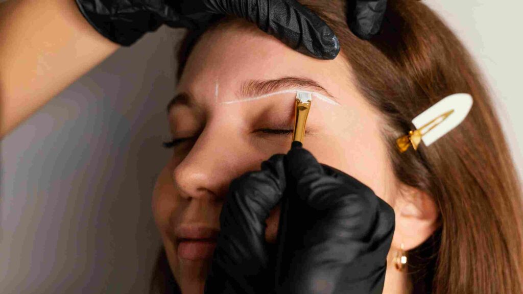 side-view-woman-getting-eyebrow-treatment-from-specialist_11zon